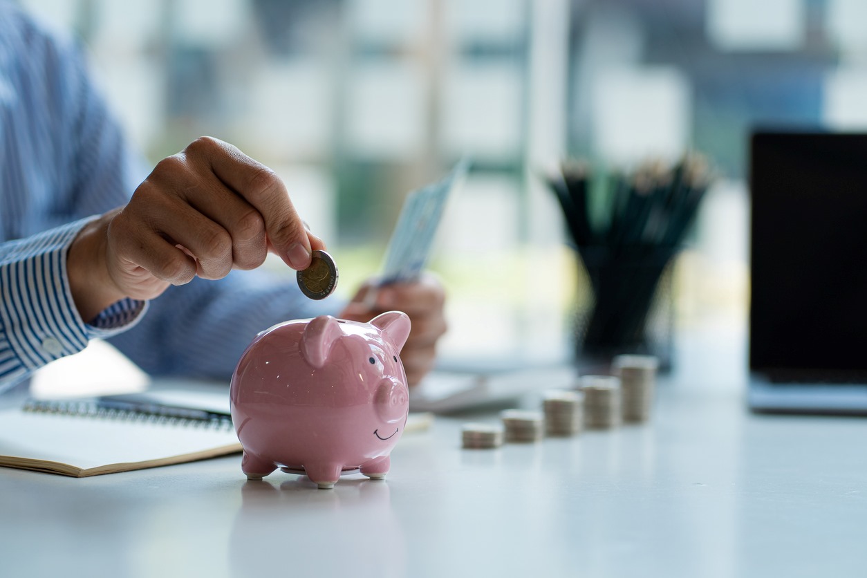 A person saves their pennies as they keep their business costs low.